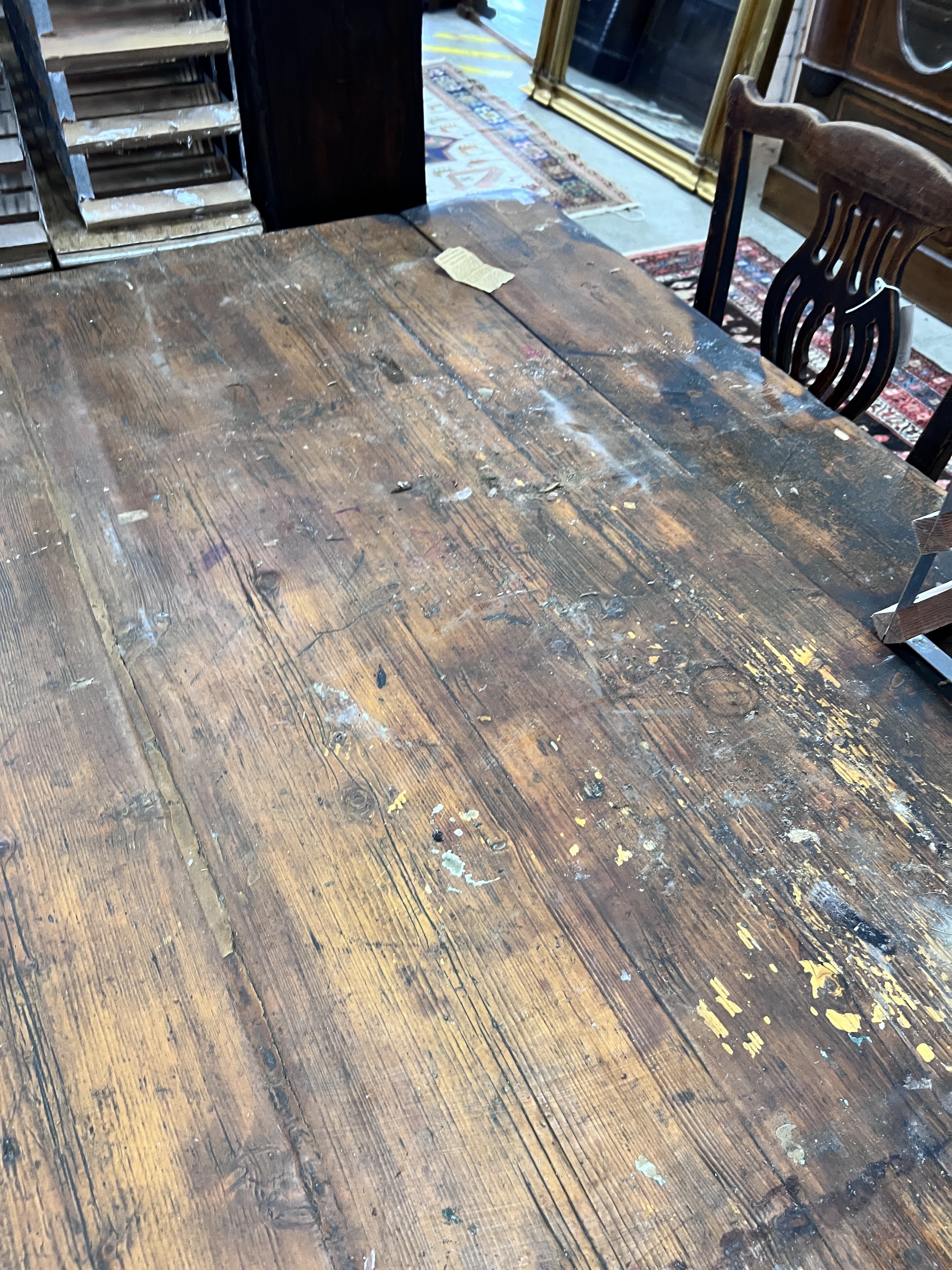 A 19th century rectangular pine planked top kitchen table, length 206cm, width 102cm, height 71cm